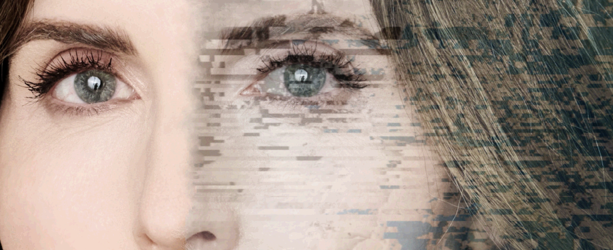 image of a woman's face with green eyes, the right side is partially blurred with digital blue/green splotches